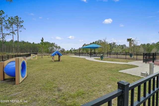 view of property's community with a yard