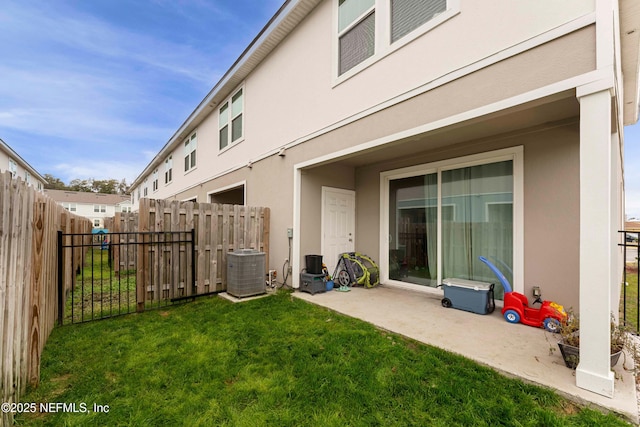 view of yard featuring a patio and central air condition unit