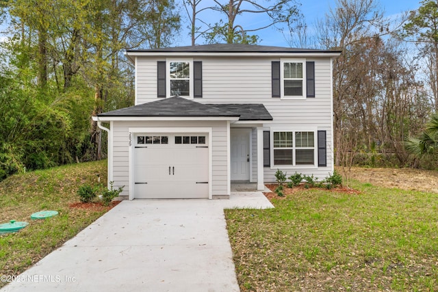 front facade with a garage and a front lawn