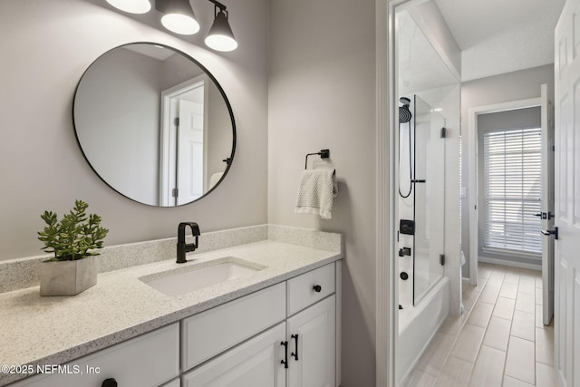 bathroom featuring vanity and shower / bathtub combination