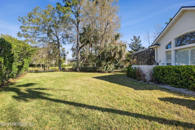 view of yard with a lanai