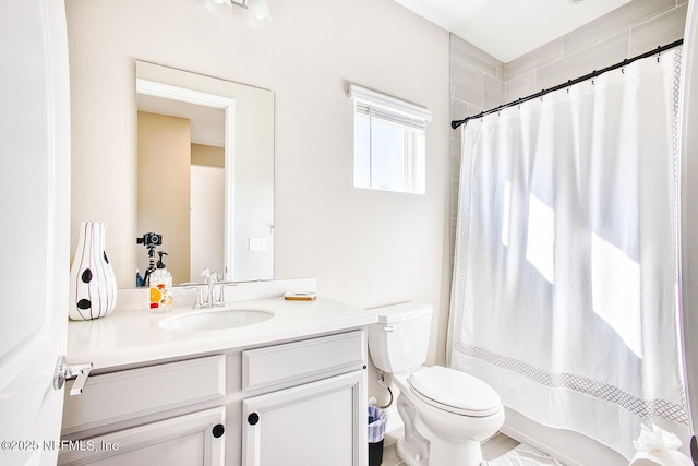 full bathroom featuring vanity, toilet, and shower / bathtub combination with curtain