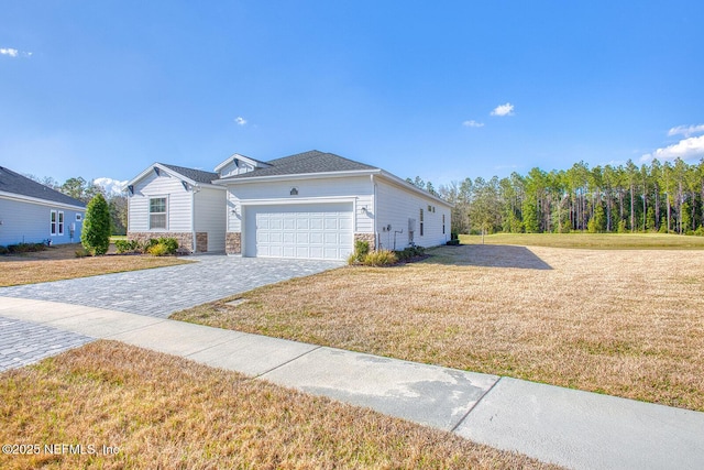 ranch-style home with a garage and a front yard