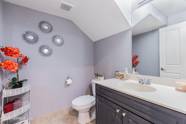 half bathroom with lofted ceiling, toilet, vanity, visible vents, and tile patterned floors
