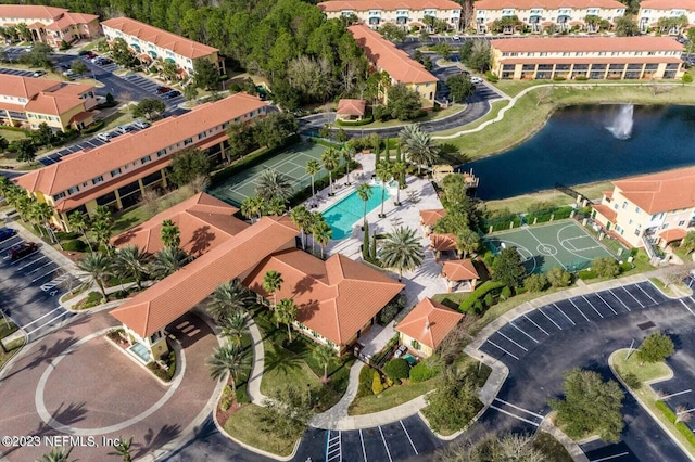 bird's eye view with a water view and a residential view