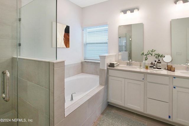 bathroom featuring shower with separate bathtub, tile patterned floors, and vanity