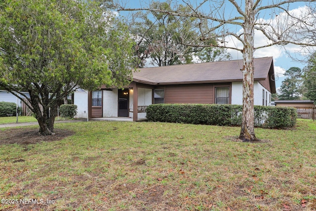 ranch-style house with a front yard