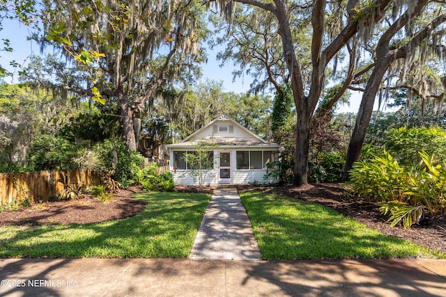 bungalow-style house with a front yard