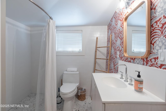 bathroom with tile patterned flooring, vanity, a shower with shower curtain, and toilet