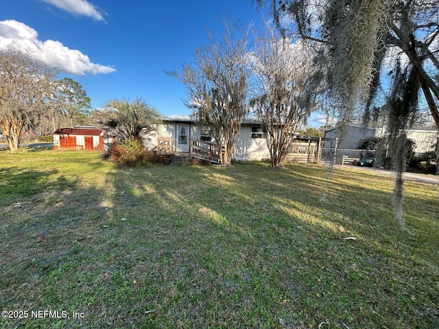 view of yard with a storage shed