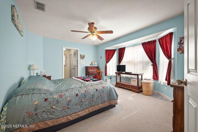 bedroom with ceiling fan and carpet flooring