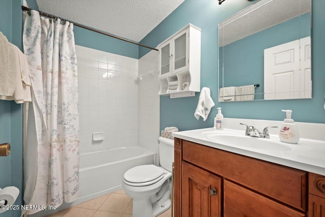 full bathroom with shower / tub combo, vanity, a textured ceiling, tile patterned floors, and toilet