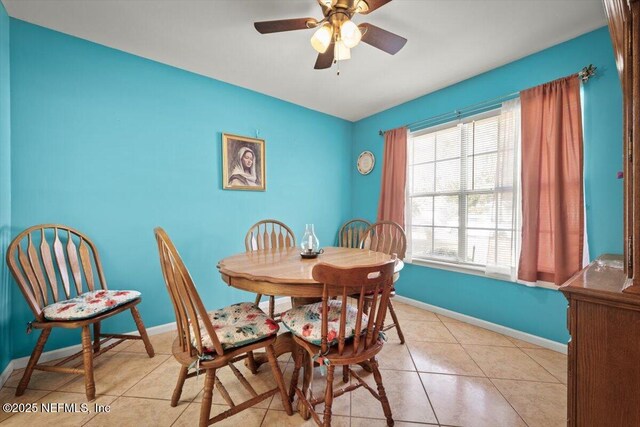 dining area featuring light tile patterned floors and ceiling fan