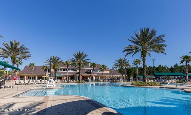 view of swimming pool with a patio