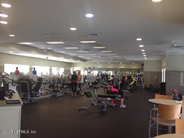 workout area featuring ceiling fan