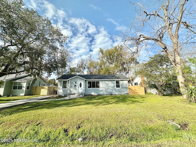 ranch-style home featuring a front yard