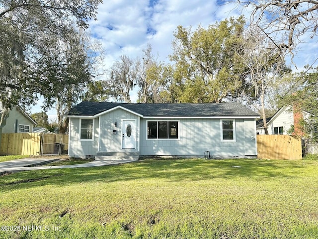 ranch-style home with a front yard