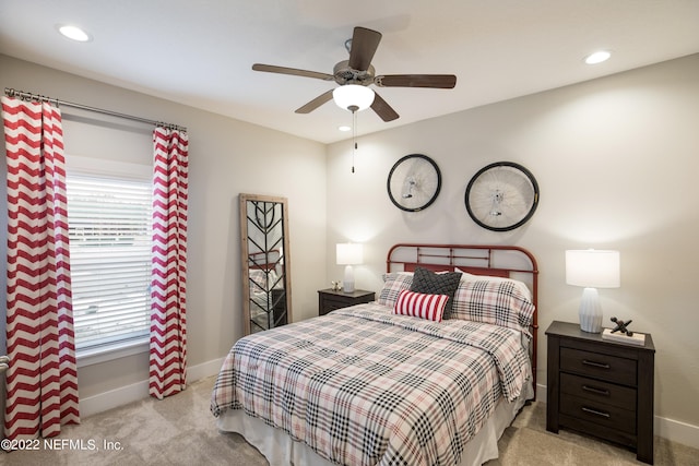 bedroom featuring light colored carpet and ceiling fan