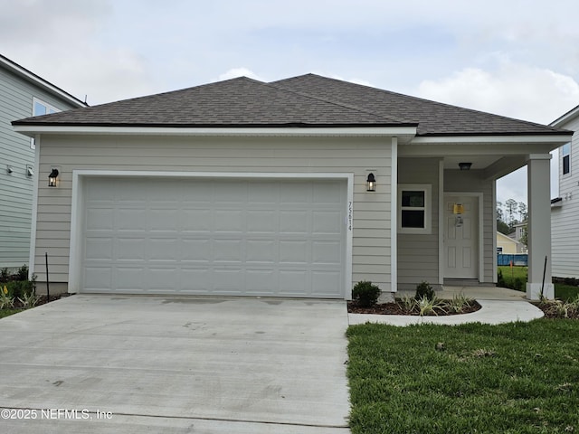 ranch-style house with a garage and a front yard