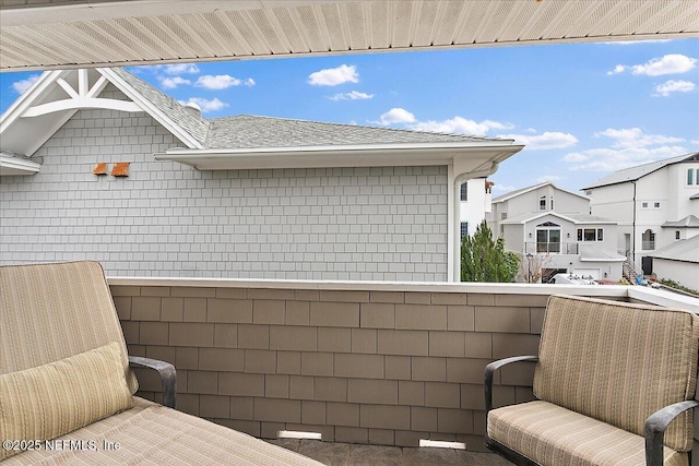 view of patio featuring a residential view and a balcony