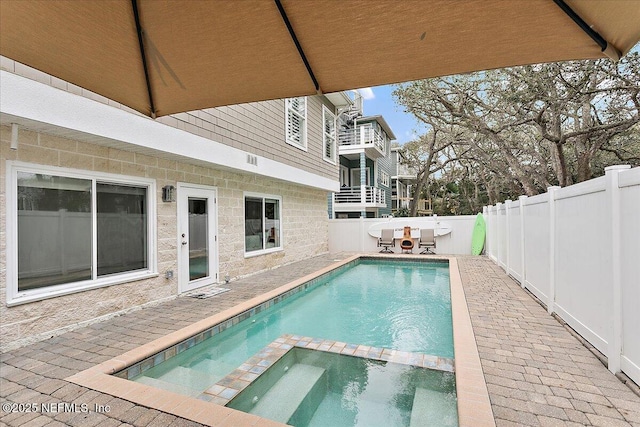 53 Oceanside Dr, Atlantic Beach, FL 32233 - view of swimming pool with a fenced backyard and a pool with connected hot tub