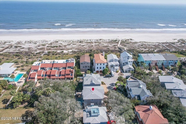 aerial view featuring a water view, a residential view, and a view of the beach