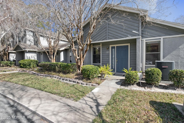 10800 Old St Augustine Rd Unit 301, Jacksonville, FL 32257 - view of front of property featuring central AC unit and a front yard