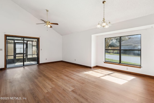 10800 Old St Augustine Rd Unit 301, Jacksonville, FL 32257 - unfurnished living room with hardwood / wood-style flooring, ceiling fan with notable chandelier, and high vaulted ceiling