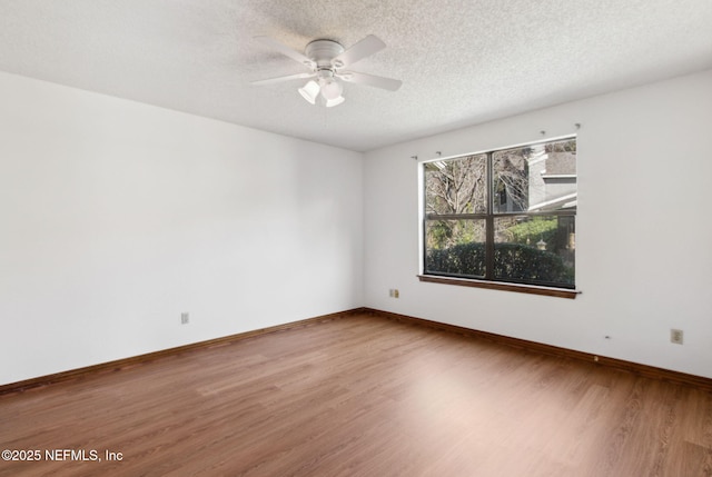 10800 Old St Augustine Rd Unit 301, Jacksonville, FL 32257 - spare room featuring ceiling fan, hardwood / wood-style flooring, and a textured ceiling