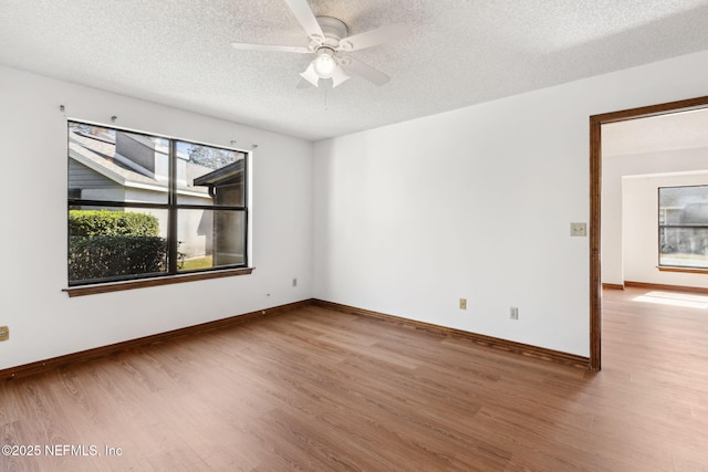 10800 Old St Augustine Rd Unit 301, Jacksonville, FL 32257 - spare room with ceiling fan, hardwood / wood-style floors, and a textured ceiling