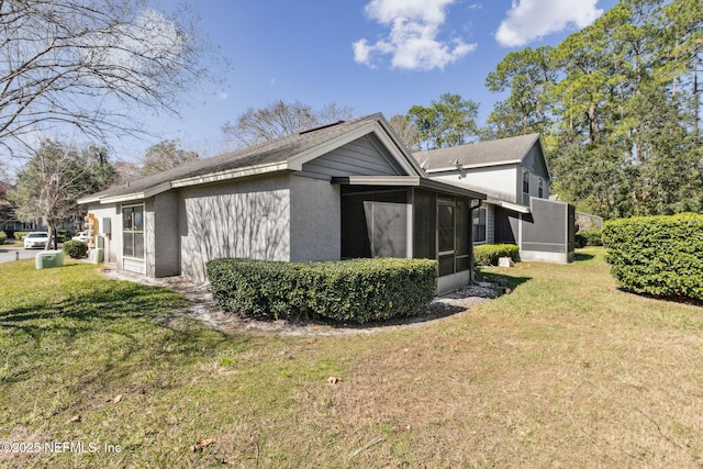 10800 Old St Augustine Rd Unit 301, Jacksonville, FL 32257 - view of side of property featuring a sunroom and a yard
