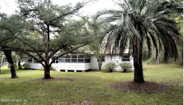 view of home's exterior featuring a lawn