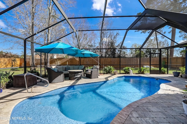 view of swimming pool with an outdoor living space, a patio area, and glass enclosure