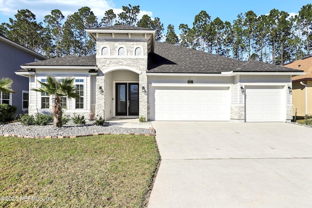 944 Laurel Valley Dr, Orange Park, FL 32065 - view of front of home featuring stone siding, a garage, driveway, and a front lawn