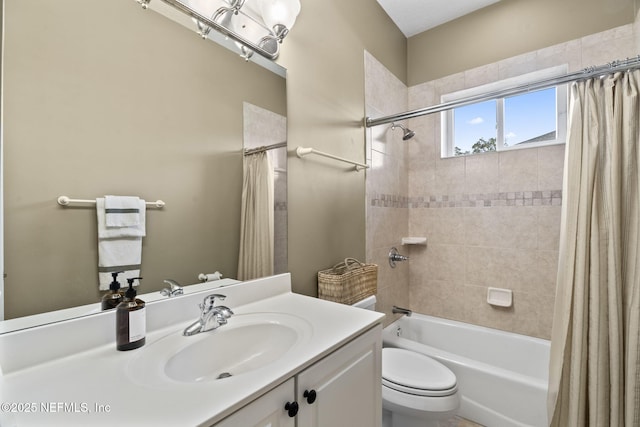 full bathroom featuring vanity, shower / bathtub combination with curtain, and toilet