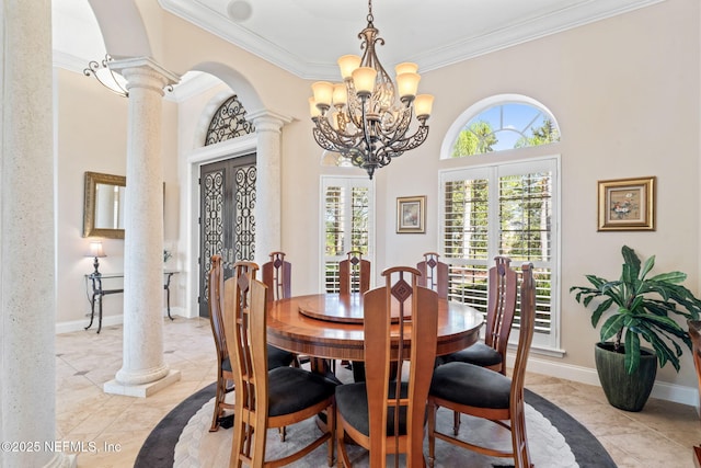 dining area featuring arched walkways, baseboards, french doors, ornate columns, and crown molding