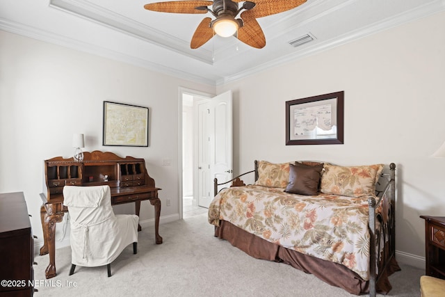 carpeted bedroom with a raised ceiling, visible vents, crown molding, and baseboards