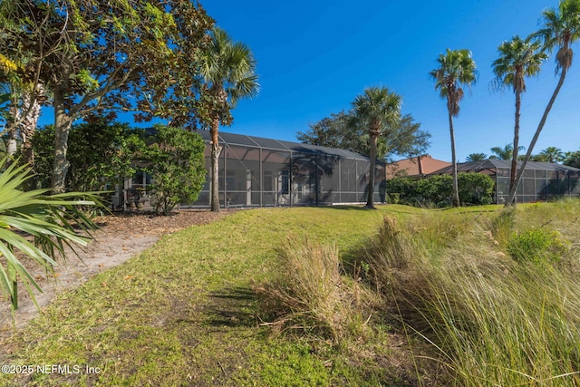 view of yard featuring glass enclosure