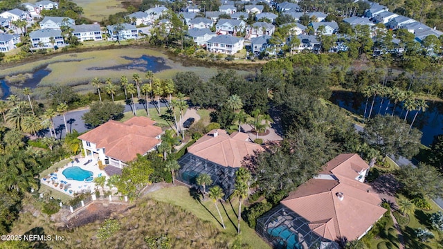 aerial view with a water view and a residential view