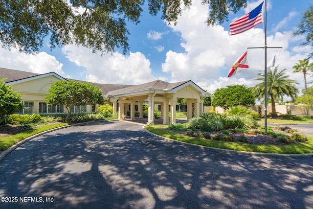 view of property featuring aphalt driveway