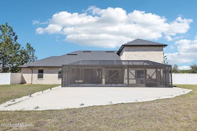 back of property with a patio area, a fenced backyard, and a lawn