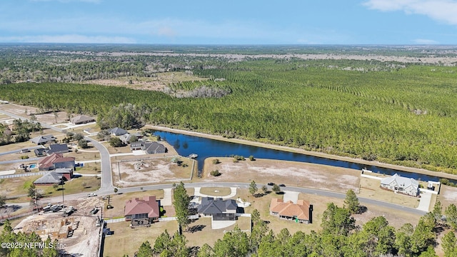 bird's eye view featuring a water view and a wooded view