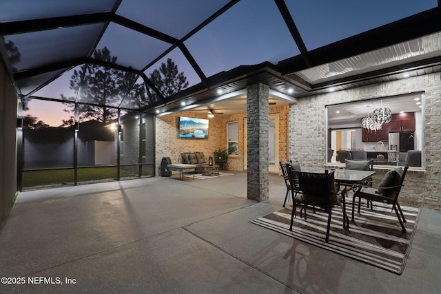 view of patio with a lanai and ceiling fan