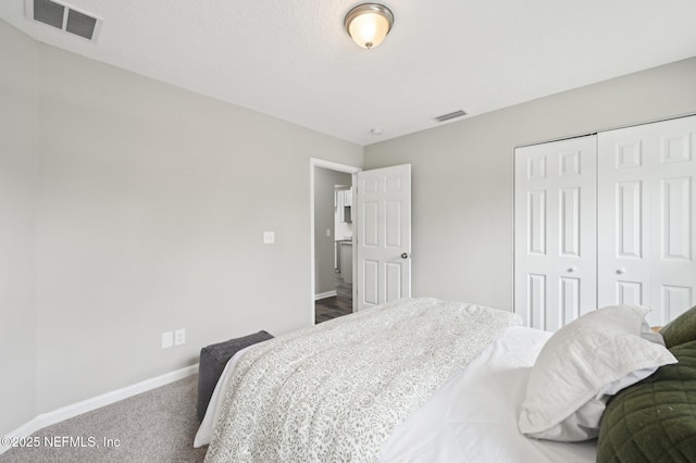 carpeted bedroom with a closet