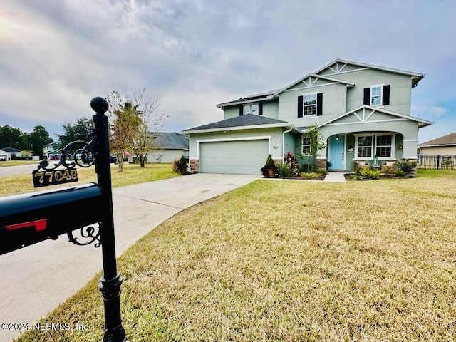 front of property featuring a garage and a front yard