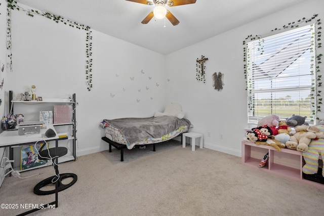 bedroom featuring light carpet and ceiling fan