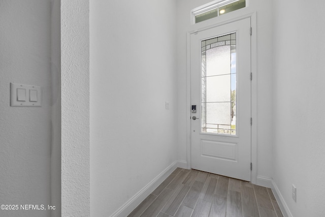 doorway to outside featuring light wood-type flooring