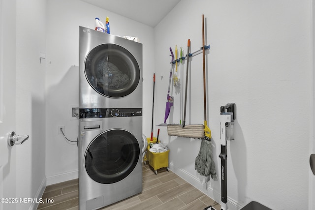 washroom with stacked washer / drying machine