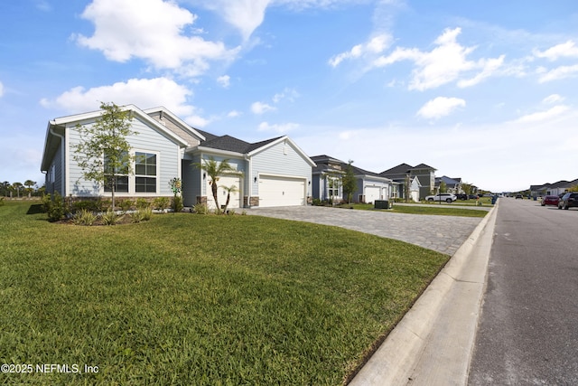 ranch-style home featuring a garage and a front lawn