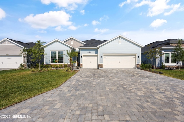 view of front of home featuring a garage and a front lawn